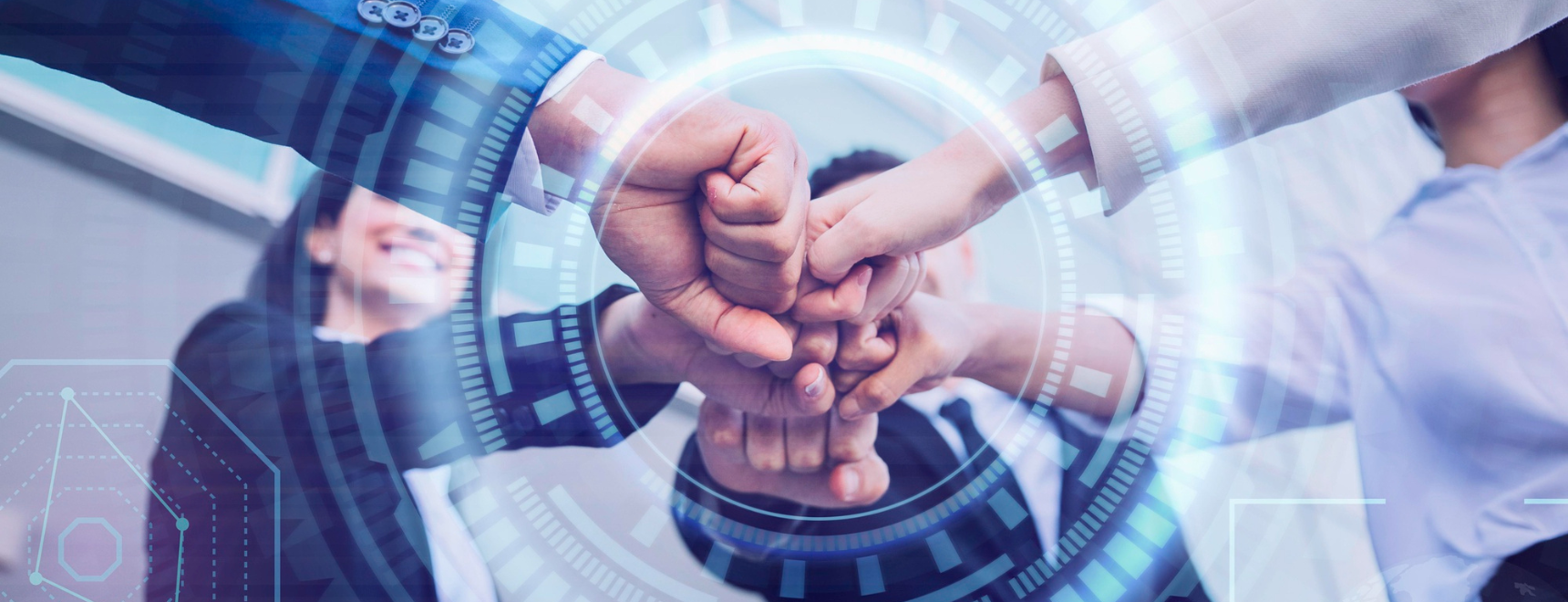 A group of business professionals performing a fist bump, symbolizing teamwork and collaboration, with a futuristic digital overlay representing data and technology.